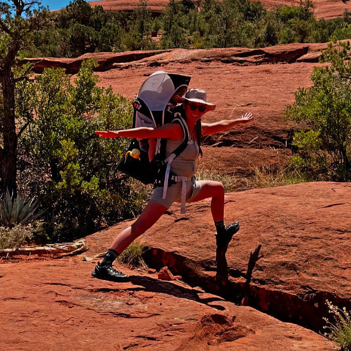 Nagisa doing yoga pose on red rocks in Sedona